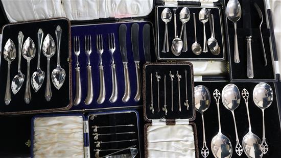 Seven assorted cased sets of silver cutlery including spoons, cocktail sticks and pistol handled dessert eaters.